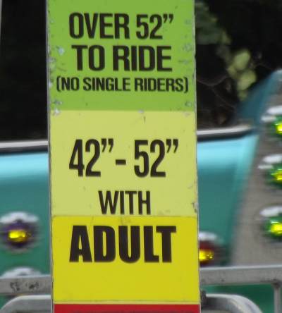 carnival ride sign, 42" to 52" must ride with adult